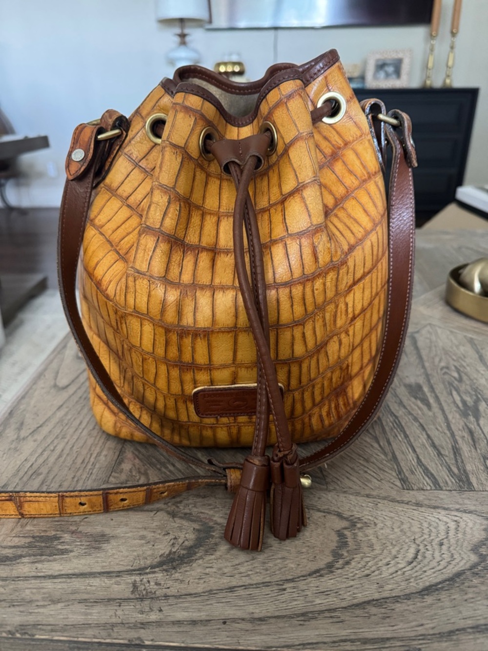 Dooney & Bourke Mustard Yellow and Brown Croc-Embossed Drawstring Bucket Bag